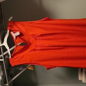 Bright orange sleeveless blouse